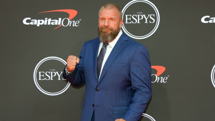 WWE personality Triple H arrives on the red carpet at Microsoft Theatre.